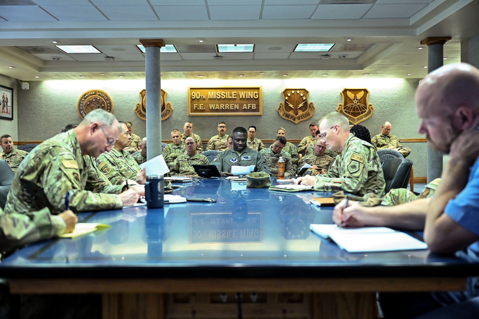 Col. Johnny Galbert, 90th Missile Wing commander, shares the local Air Force Global Strike Command Missile Community Cancer Study results with 90 MW commanders during a meeting on F.E. Warren Air Force Base, Wyoming, Aug. 21, 2023. All air samples were non-detectable for polychlorinated biphenyls (PCB). Of the 300 surface swipe samples across all 15 missile alert facilities, 17 found detectable levels of PCBs, all below the threshold set by the U.S. Environmental Protection Agency for mitigation. (U.S. Air Force photo by Joseph Coslett Jr.)