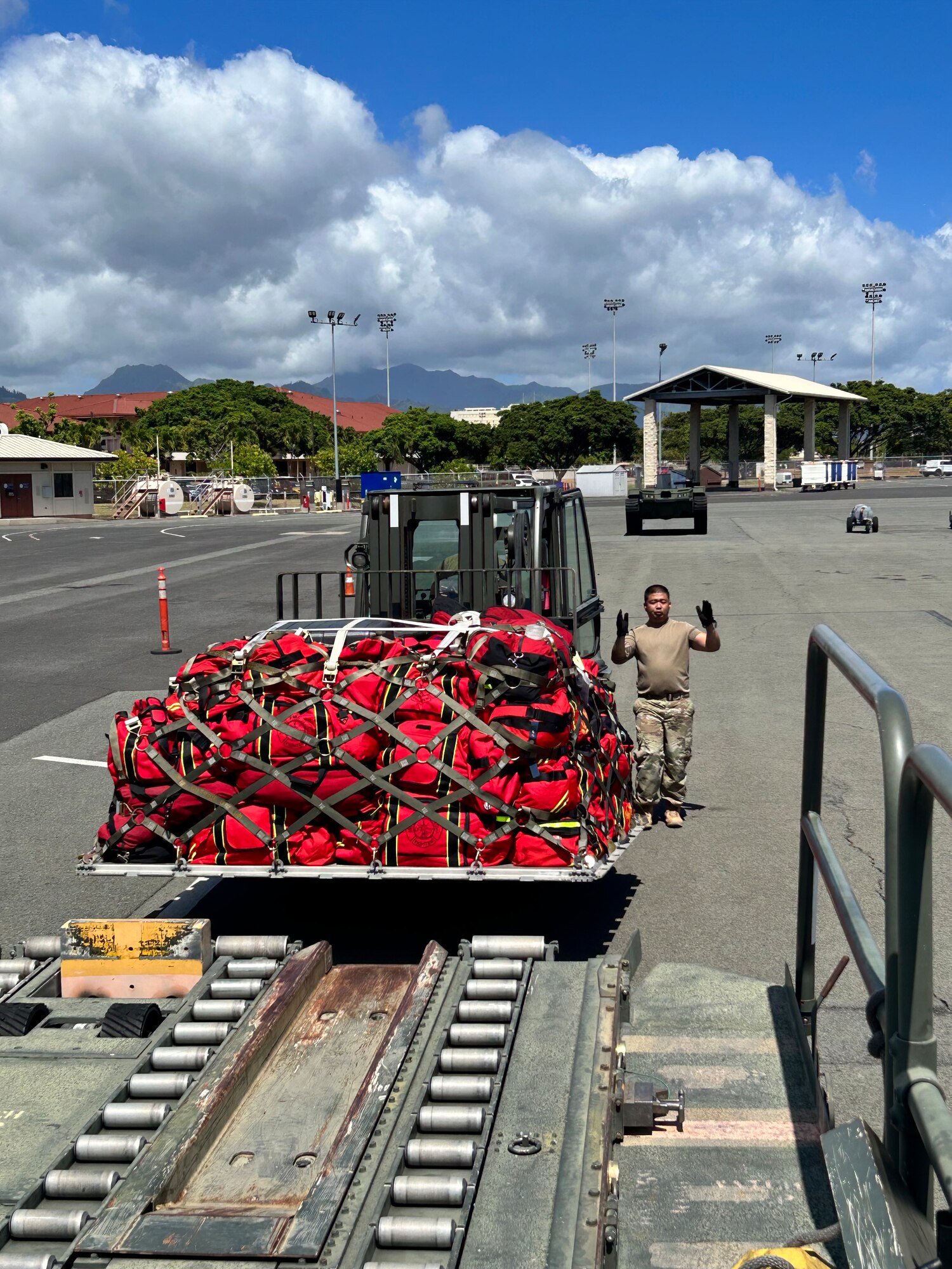 Master Sgt. Shane Costa, 48th Aerial Port Squadron assigned to the 624th Regional Support Group, performed a joint inspection on vehicles from the Honolulu Fire Department and cargo in response to the wildfires on the island of Maui, Joint Base Pearl Harbor-Hickam, Hawaii, Aug. 10, 2023.