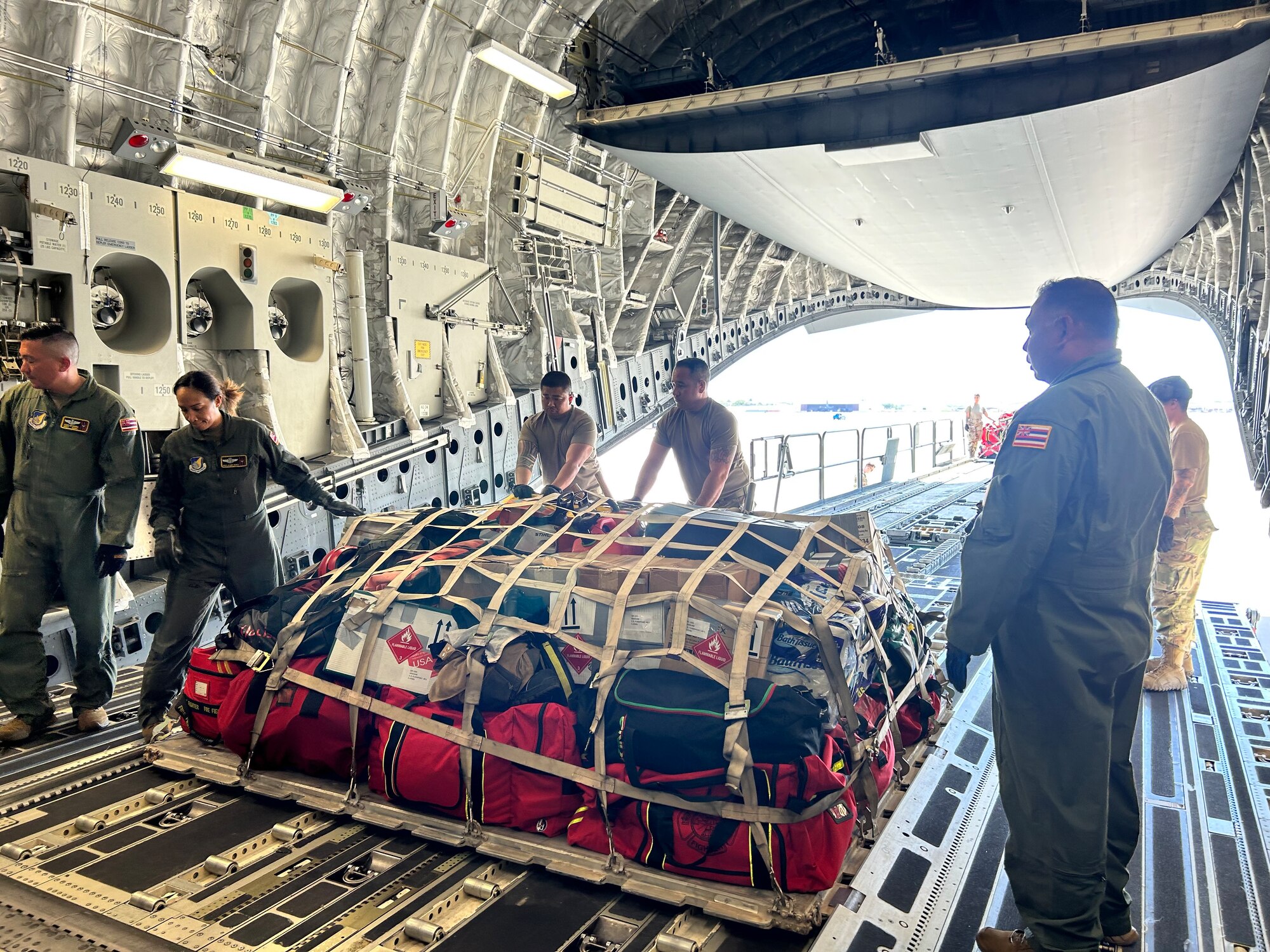 Master Sgt. Shane Costa, 48th Aerial Port Squadron assigned to the 624th Regional Support Group, performed a joint inspection on vehicles from the Honolulu Fire Department and cargo in response to the wildfires on the island of Maui, Joint Base Pearl Harbor-Hickam, Hawaii, Aug. 10, 2023.