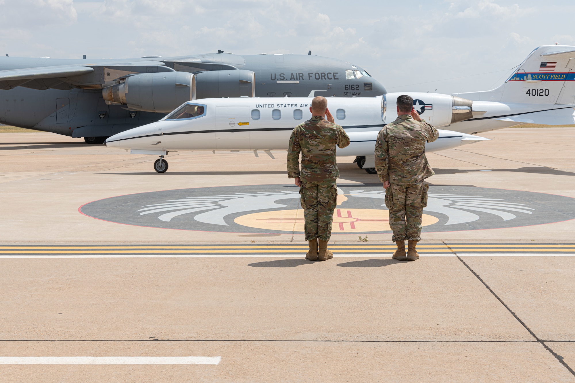 Col. Jeremy Bergin, 27th Special Operations Wing commander, and Chief Master Sgt. Colin Fleck, 27 SOW command chief, salute Air Force Special Operations Command leadership as they depart during a visit to Cannon Air Force Base, N.M., Aug. 22, 2023. Lt. Gen. Tony Bauernfeind, Air Force Special Operations Command commander and the 27 SOW leadership team hosted a meeting to discuss transforming AFSOC force structure for a fifth power projection wing, greater force development, and growth for Air Commandos with congressional and community leaders. (U.S. Air Force photo by Senior Airman Drew Cyburt)