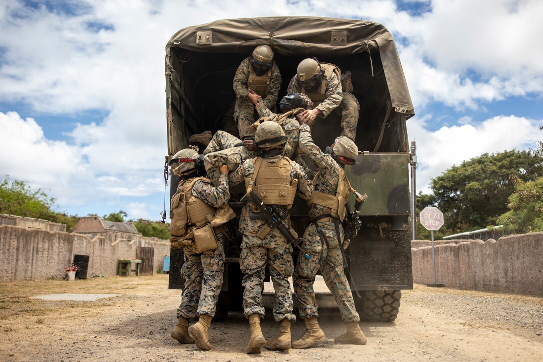 U.S. Marines with 3d Littoral Combat Team, 3d Marine Littoral Regiment, 3d Marine Division, prepare to transport a simulated casualty during Pololu Strike at Marine Corps Training Bellows, Hawaii, August 15, 2023. Pololu Strike is a 3d MLR exercise consisting of staff education, planning, and battalion-led field training. The training focuses on the education and development of 3d MLR and battalion staffs, deliberate planning repetitions, and execution of training and readiness standards in a field environment. (U.S. Marine Corps photo by Sgt. Israel Chincio)