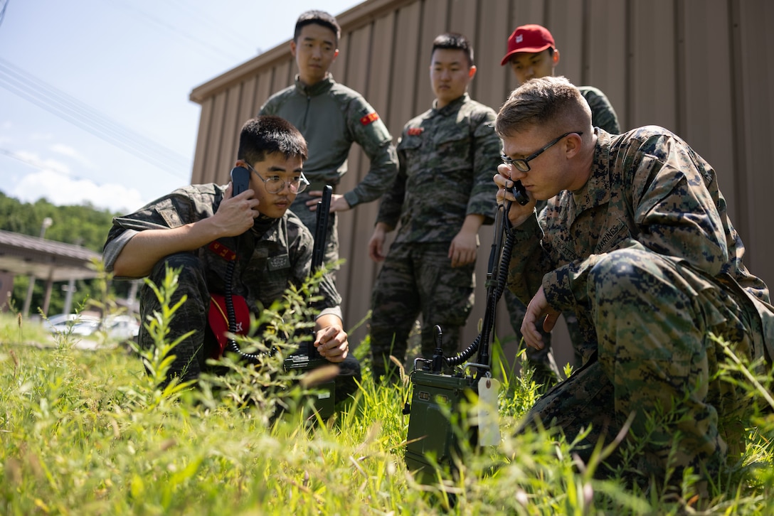 U.S. Marine Corps Sgt. Joshua Ricketts and Republic of Korea Marines conduct a radio check on a AN/PRC-117G radio for single-channel and encrypted voice traffic during Korea Marine Exercise Program 23.3 in the Republic of Korea, Aug. 7, 2023. The Marines are with 3d Battalion, 5th Marines and are forward deployed in the Indo-Pacific under 4th Marine Regiment, 3d Marine Division as part of the Unit Deployment Program. KMEP is conducted routinely to maintain the interoperability, proficiency, and combined readiness of the ROK-U.S. forces.

This is the first time a U.S. Department of Defense entity has achieved encrypted voice communication with ROK Marines. (U.S. Marine Corps photo by Sgt. Jennifer Andrade)
