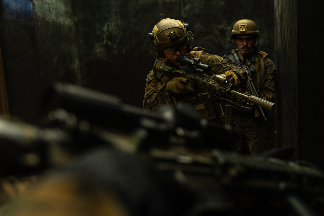 U.S. Marines prepare to breach a door with M27 infantry automatic rifles in a shoot house training facility during Korea Marine Exercise Program 23.3 in the Republic of Korea, July 31, 2023. KMEP is conducted routinely to maintain the interoperability, proficiency, and combined capabilities of the ROK-U.S. forces. The Marines are with 3d Battalion, 5th Marines and are forward deployed in the Indo-Pacific under 4th Marine Regiment, 3d Marine Division as part of the Unit Deployment Program. (U.S. Marine Corps photo by Cpl. Noah Masog)