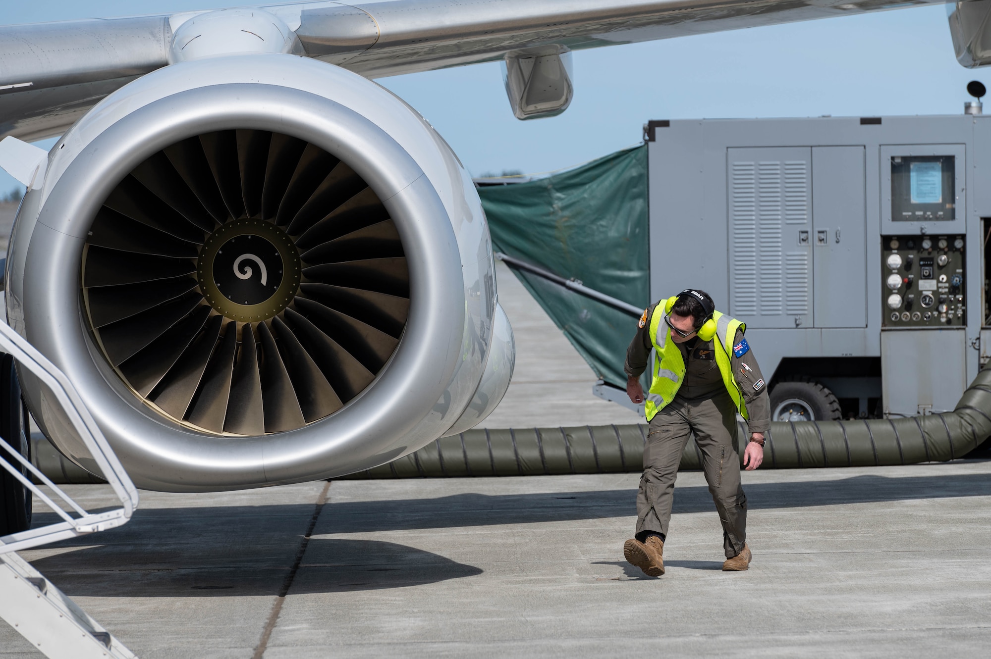 RAAF member performing preflight inspection.