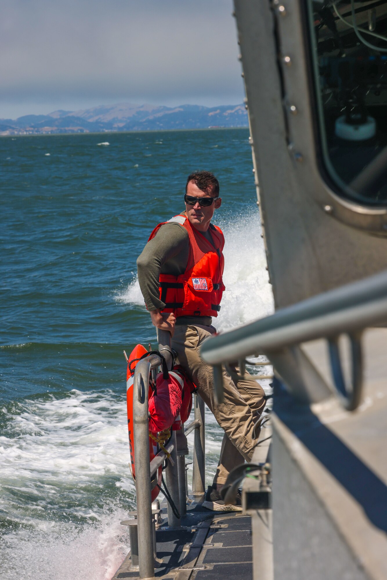 U.S. Air Force Capt. Dustin Bennett, Physicians Assistant, 9th Health Care Operations Squadron, fills the role of medic during the Search and Rescue Exercise (SAREX) in the San Francisco Bay, California Aug. 17, 2023.