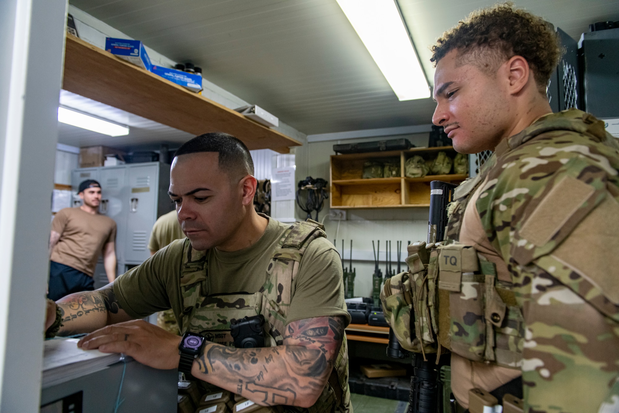 Photo of two men filling out paperwork