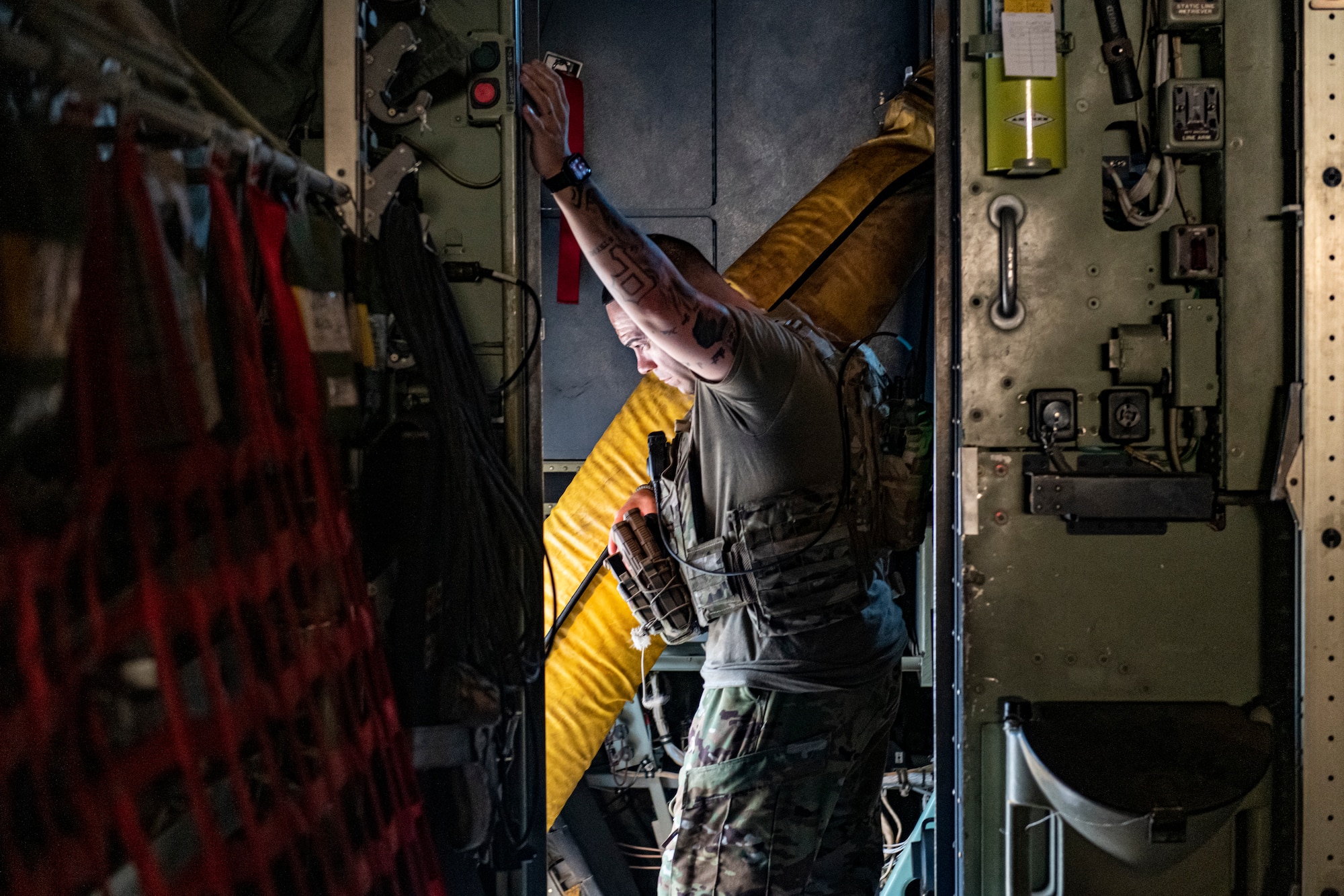 Photo of a man standing inside an aircraft