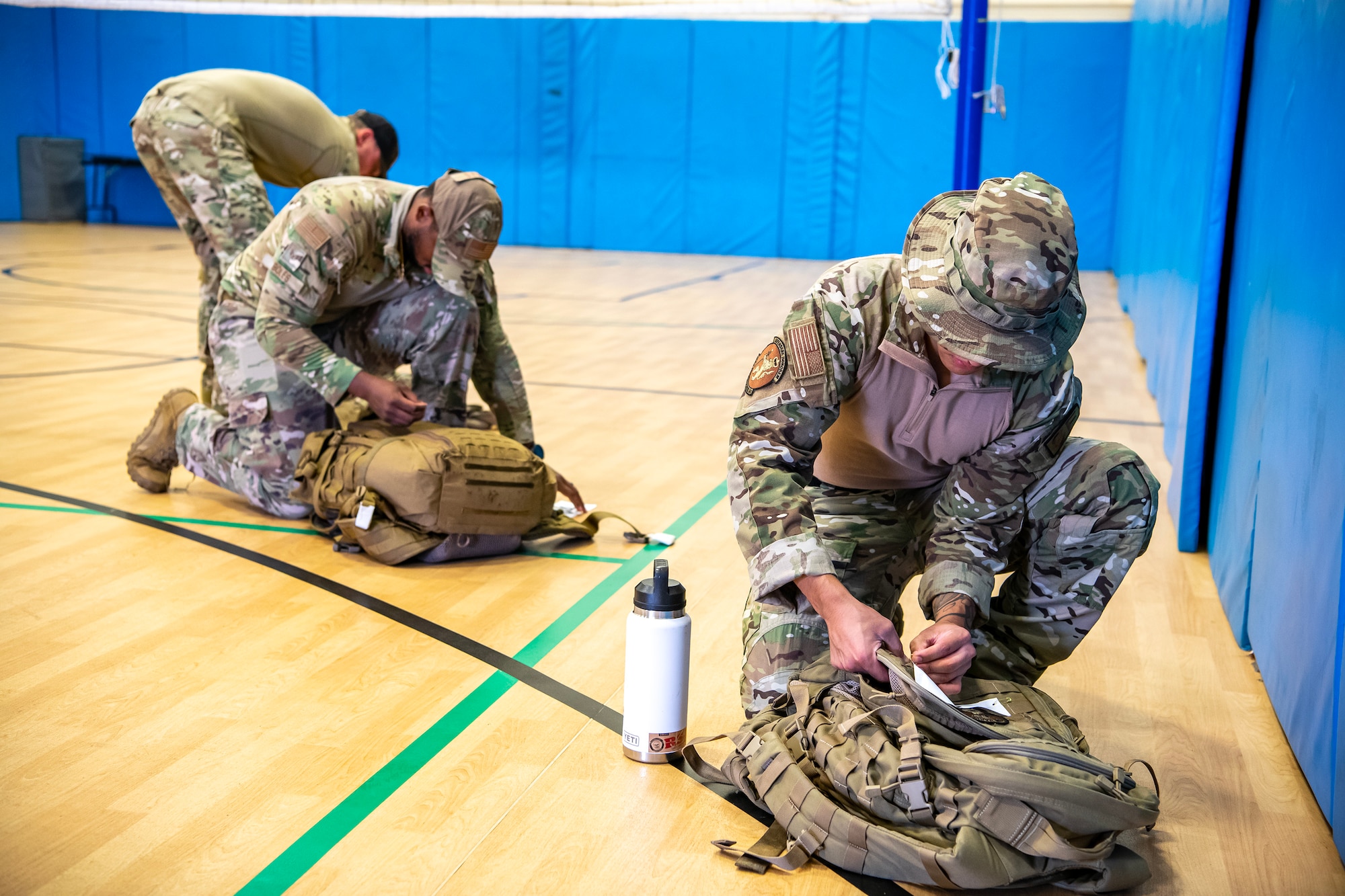 Airmen from the 501st Combat Support Wing, weigh their rucksacks at RAF Molesworth, England, Aug. 18, 2023. Over 100 personnel from the 501st CSW and mission partner units participated in a 25 Kilometer Danish Contingent ruck march, which allowed them to test their physical capabilities and encouraged social bonds between joint forces. The DANCON ruck march has been completed in numerous countries throughout the world since it was established in 1972. (U.S. Air Force photo by Staff Sgt. Eugene Oliver)