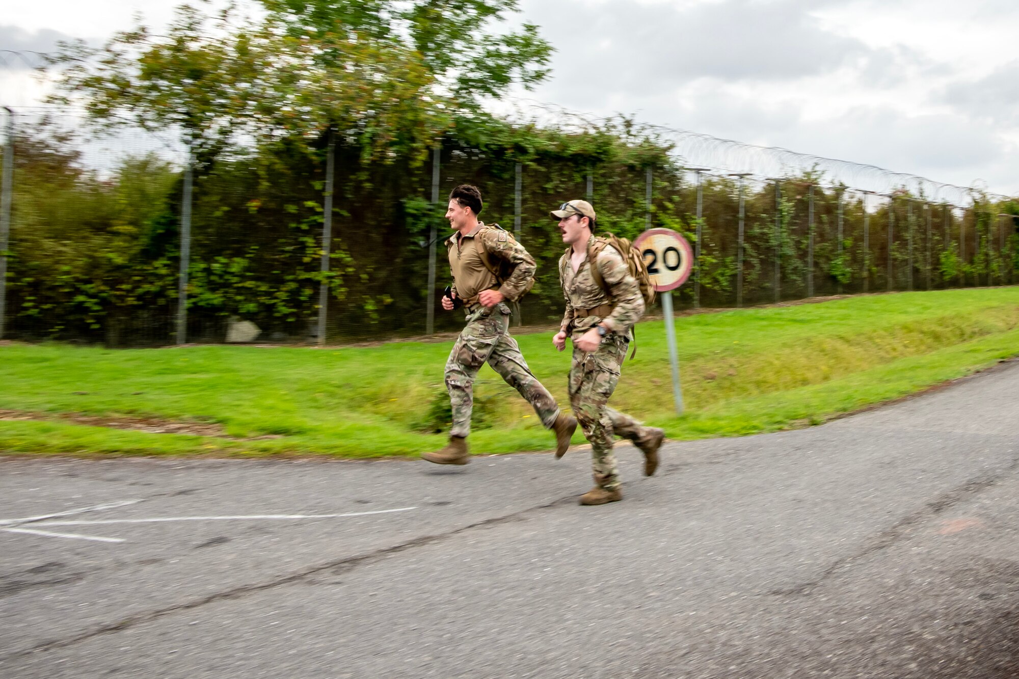 Participants complete a ruck march at RAF Molesworth, England, Aug. 18, 2023. Over 100 personnel from the 501st CSW and mission partner units participated in a 25 Kilometer Danish Contingent ruck march, which allowed them to test their physical capabilities and encouraged social bonds between joint forces. The DANCON ruck march has been completed in numerous countries throughout the world since it was established in 1972. (U.S. Air Force photo by Staff Sgt. Eugene Oliver)