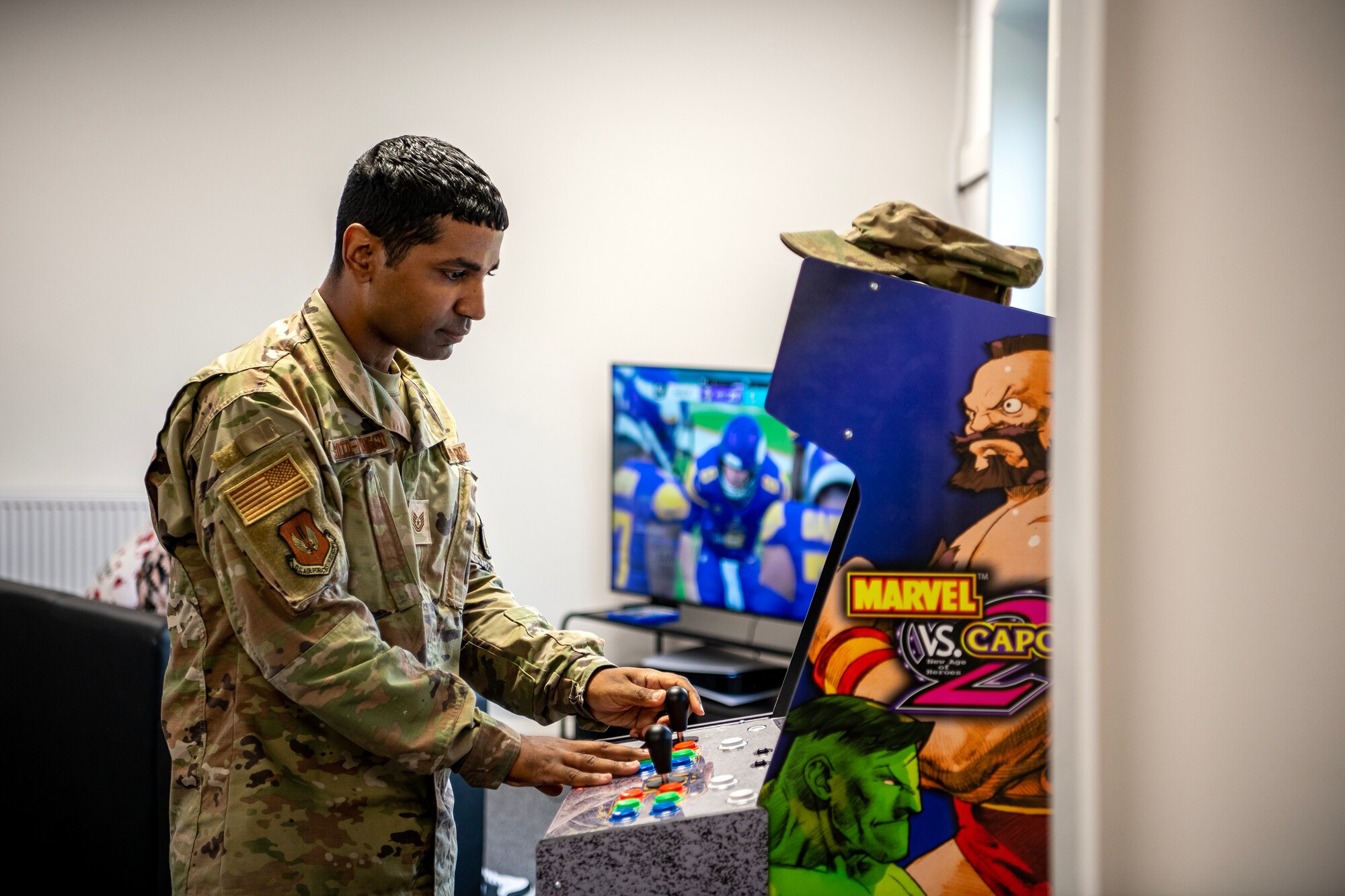 A member of the 501st Combat Support Wing plays a video game at RAF Alconbury, England, Aug. 18, 2023. The 423d Force Support Squadron opened a new teen center to provide children on base a place to interact after school. The teen center was reestablished to provide youth on base an additional outlet for social interaction and entertainment. (U.S. Air Force photo by Staff Sgt. Eugene Oliver)