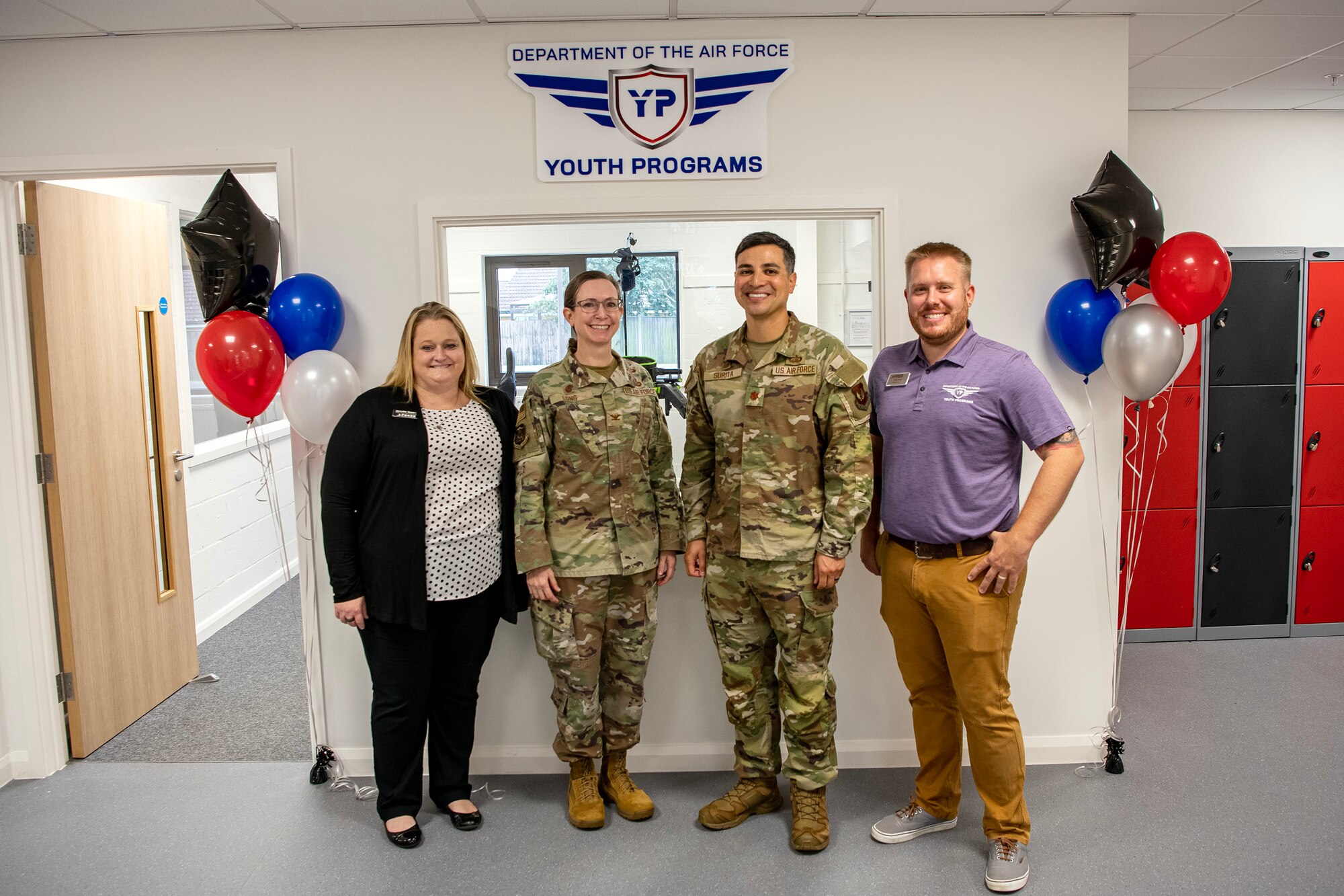 Leadership from the 501st Combat Support Wing stand inside the teen center at RAF Alconbury, England, Aug. 18, 2023. The 423d Force Support Squadron opened a new teen center to provide children on base a place to interact after school. The teen center was reestablished to provide youth on base an additional outlet for social interaction and entertainment. (U.S. Air Force photo by Staff Sgt. Eugene Oliver)