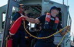 Petty Officer 2nd Class Liam Coleman, a boatswain's mate assigned to Coast Guard Station Destin, and Petty Officer 3rd Class Gabe Waldrop, a machinery technician assigned to Station Destin, participate in tow training near Destin, Florida on June 23, 2022. Station Destin personnel performed tow training in the weeks prior to Fourth of July weekend. (U.S. Coast Guard photo by Petty Officer 3rd Class Gabriel Wisdom)