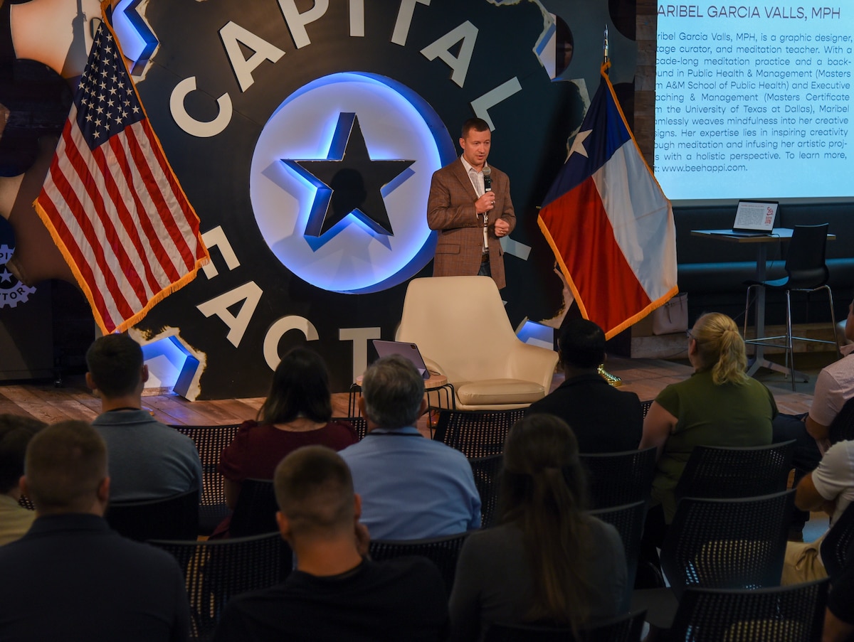 Col. Elliott Leigh, AFWERX director and chief commercialization officer for the Department of the Air Force, kicks off Fed Supernova with 22 minutes of wellness at Capital Factory in Austin, Texas, Aug. 23, 2023. Leigh encourages everyone to take 22 minutes each day to focus on something that brings joy in their life. AFWERX invited Maribel Gabriel Valls, a meditation teacher, to lead a morning mindfulness session to create a lasting habit of self-care and improve long-term well-being. (U.S. Air Force photo by Matthew Clouse)