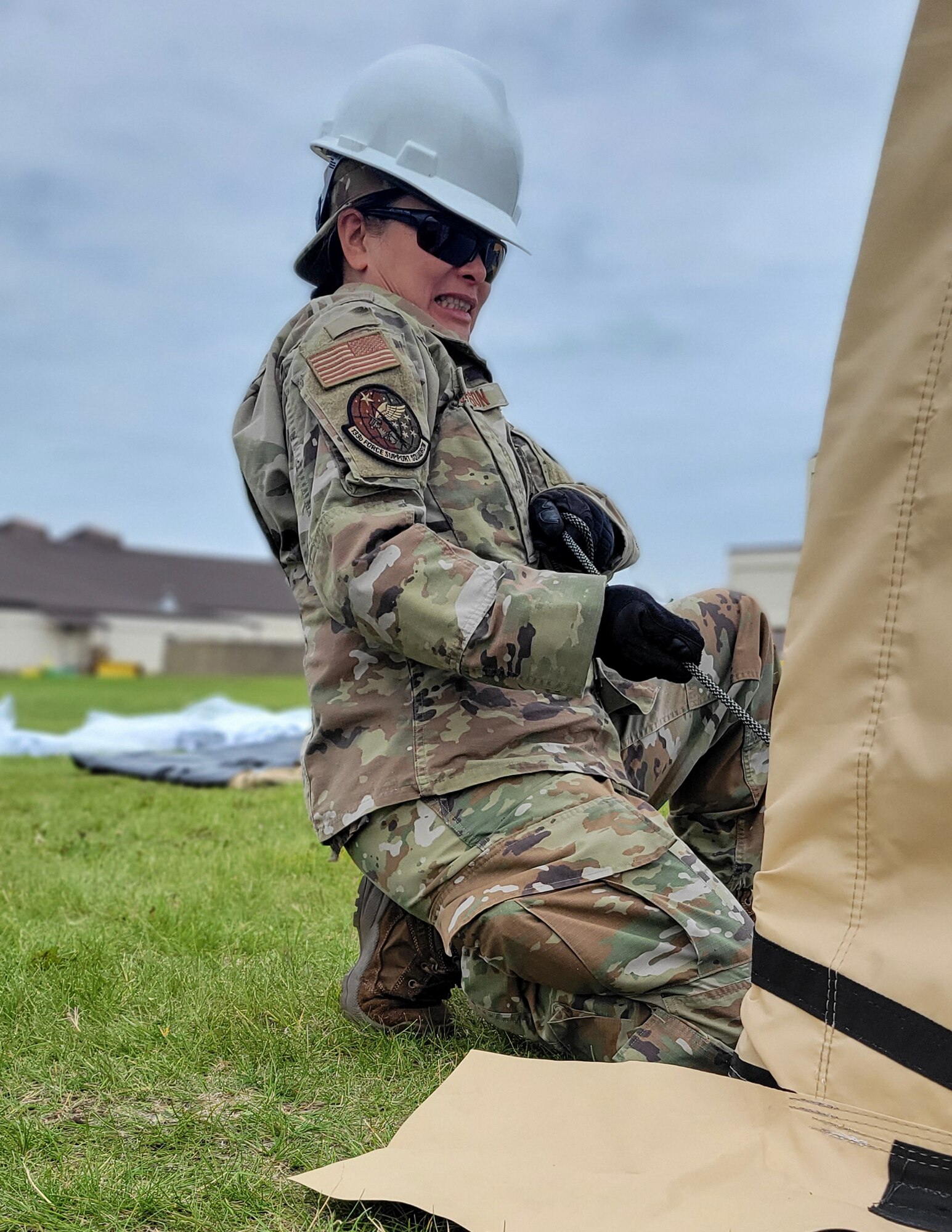 U.S. Air Force Tech. Sgt. Dieuhuyen Johnson, 133rd Force Support Squadron, pulls a rope on a tent at Joint Base Elmendorf-Richardson, Alaska, July 26, 2023.