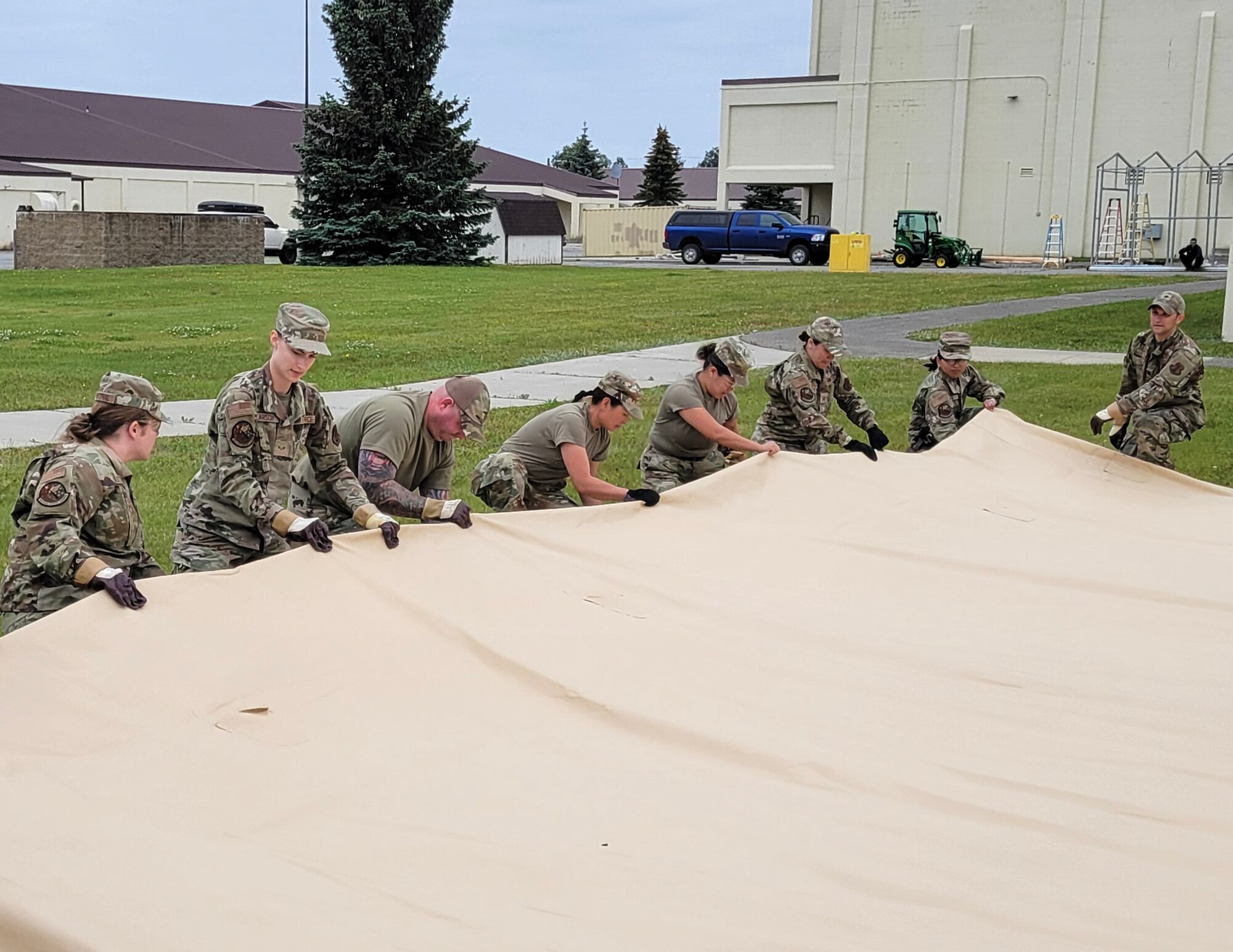U.S. Air Force Airmen from the 133rd Force Support Squadron, prepare to set up an Alaska Small Shelter System at Joint Base Elmendorf-Richardson, Alaska, July 26, 2023.