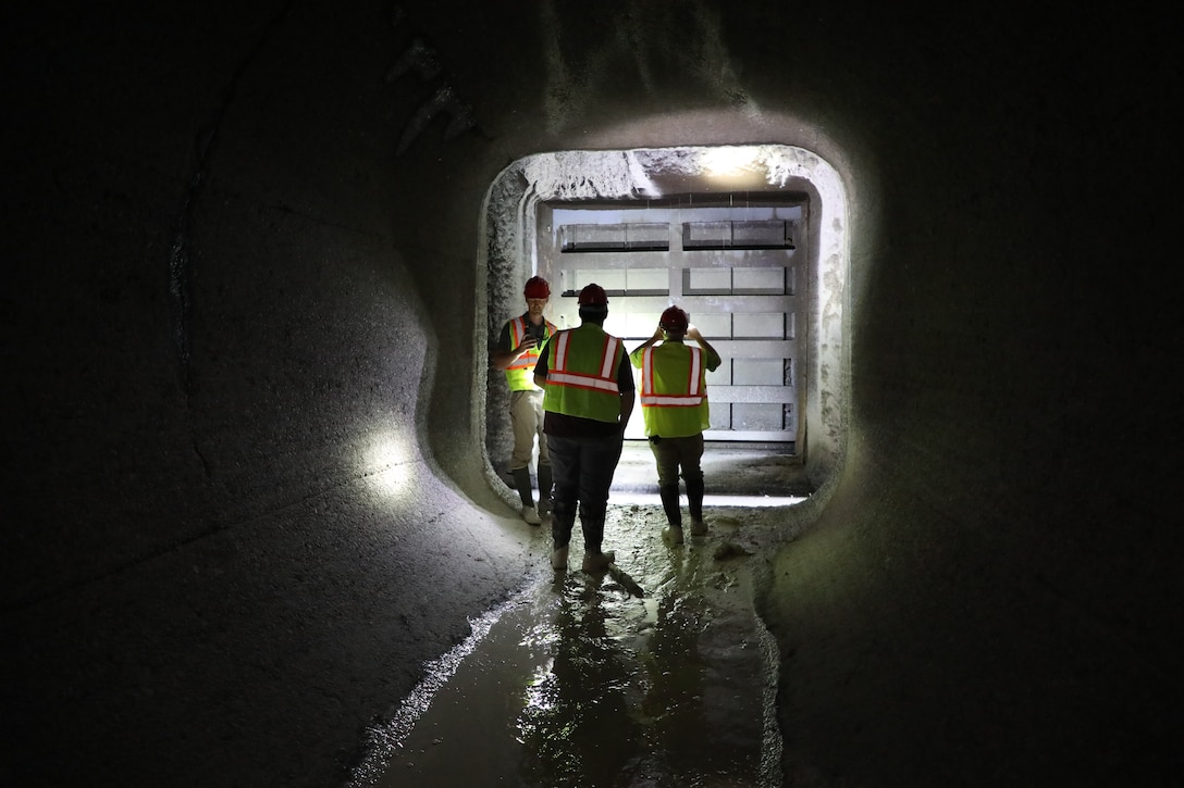Members of the Brandon Road Interbasin Project Technical Team tour the inside of the transfer tunnel at the lock during a dewatering.