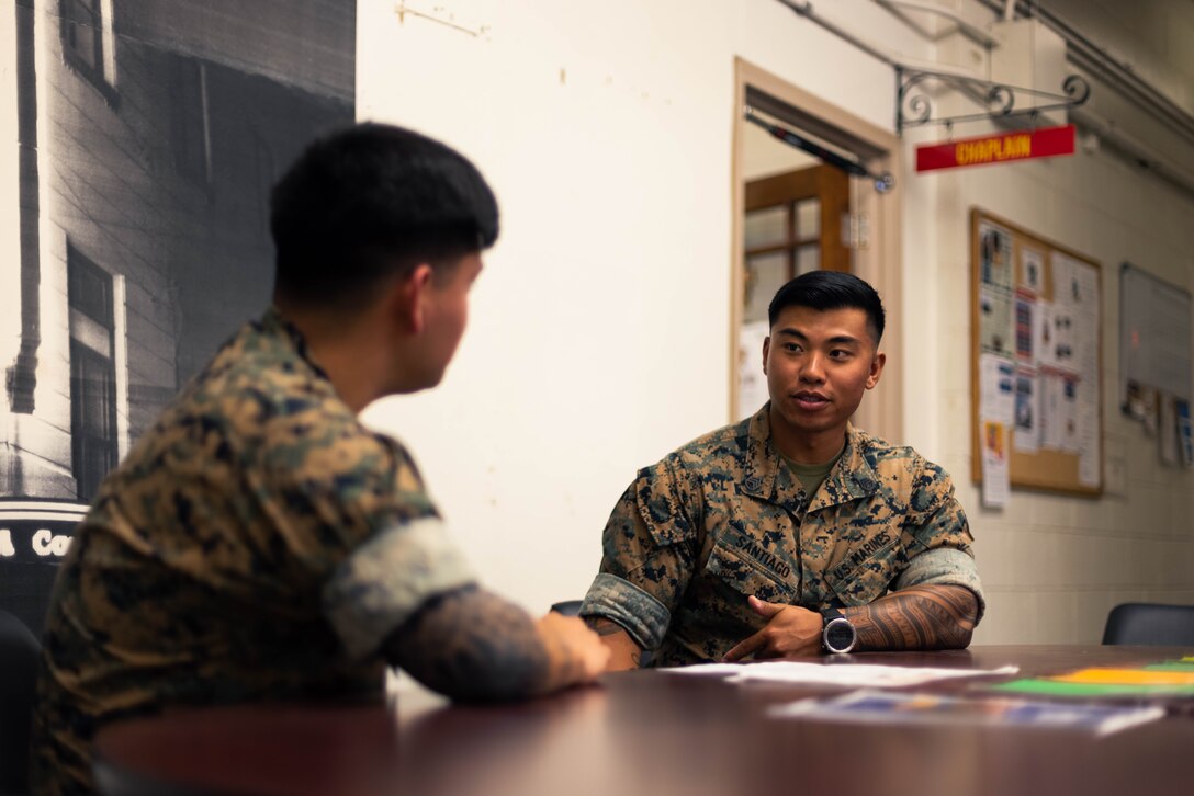 U.S. Marine Corps Sgt. Luis Gomez, a Wheeling, Illinois native and field artillery fire direction control Marine with 1st Battalion, 12th Marines, 3d Marine Division, speaks to Staff Sgt. Ramon Santiago, a Yorktown, Virginia native and joint terminal attack controller with 1st Battalion, 12th Marines, 3d Marine Division, about the Direct Affiliation Program on Marine Corps Base Hawaii, May 12, 2023. The DAP affords qualified active component Marines the opportunity to affiliate with a Selected Marine Corps Reserve unit or the Individual Mobilization Augmentee program following their expiration of active service with no break in service.