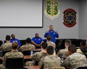 Senior Master Sgt. (Ret.) Carlos Villarreal, outreach ambassador coordinator for Air Force Wounded Warrior Program (AFW2), speaks to Airmen from the 791st Security Forces Squadron Monday Aug. 21, 2023 at Minot Air Force Base, North Dakota. The AFW2 team visited Team Minot Airmen to share stories of resiliency. (U.S. Air Force photo by Senior Airman Caleb S. Kimmell)