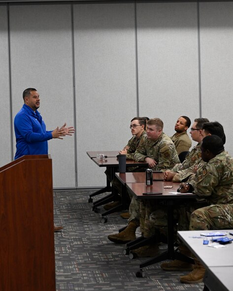 Senior Master Sgt. (Ret.) Carlos Villarreal, outreach ambassador coordinator for Air Force Wounded Warrior Program (AFW2), speaks to Airmen from the 791st Security Forces Squadron Monday Aug. 21, 2023 at Minot Air Force Base, North Dakota. The AFW2 team visits CONUS bases to tell their stories of resiliency and experiences. (U.S. Air Force photo by Senior Airman Caleb S. Kimmell)