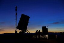 As dusk descends, Marines and civilians from Program Executive Officer Land System’s Ground Based Air Defense program assemble around the PEO’s cutting-edge Medium Range Intercept Capability system. Serving as the Corps’ first medium range missile capability since the HAWK system, this state-of-the-art capability is a key example of successful acquisition under FD 2030. (Marine Corps courtesy photo)