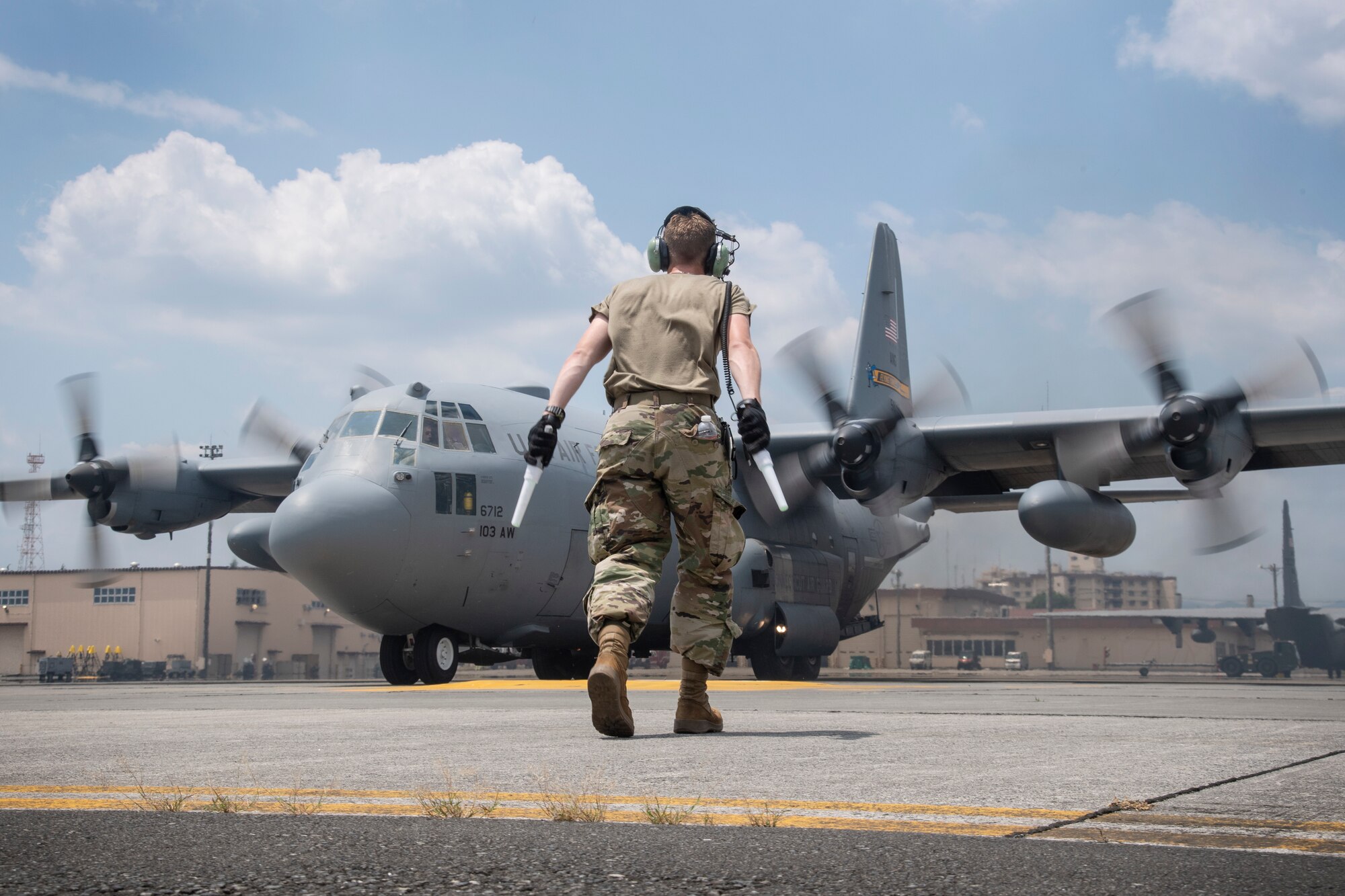 Staff Sgt. Jacob Roy, Air National Guard, marshals a C-130 Hercules at Yokota Air Base, Japan, July 17, 2023, in support of Mobility Guardian 2023. Air National Guardsmen from Missouri, Montana and Connecticut worked together as one unit to during to ensure C-130s could perform rapid global mobility in support of MG23. A multilateral endeavor, MG23 features seven participating countries – Australia, Canada, France, Japan, New Zealand, United Kingdom, and the United States – operating approximately 70 mobility aircraft across multiple locations spanning a 3,000-mile exercise area from July 5-21. Our Allies and partners are one of our greatest strengths and a key strategic advantage. MG23 is an opportunity to deepen our connections with regional Allies and partners using bold initiatives. (U.S. Air Force photo by Tech. Sgt. Christopher Hubenthal)