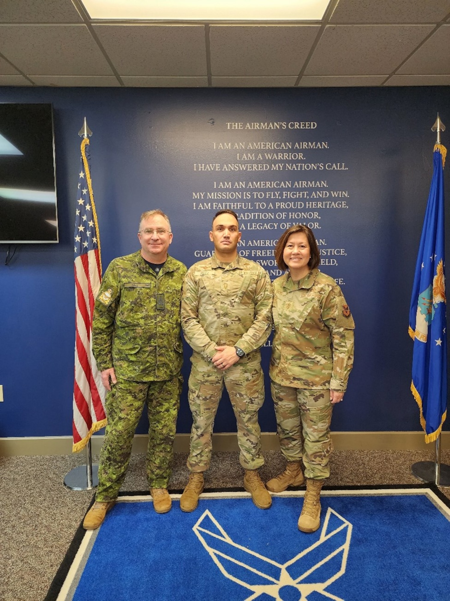 Language Enabled Airman Program Scholar Senior Master Sgt. Alejandro Velez with Chief Master Sergeant of the Air Force Joanne Bass and her equivalent Royal Canadian Air Force Command Chief Warrant Officer John Hall. (Courtesy Photo)