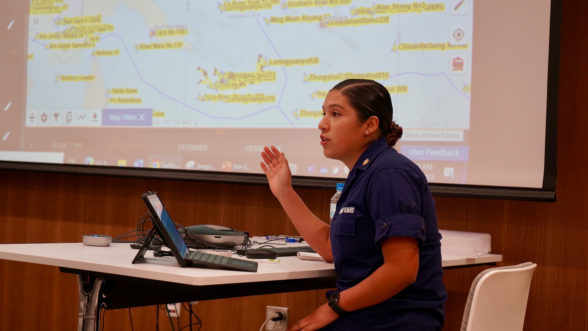 Petty Officer 1st Class Monse Rivera of U.S. Coast Guard 14th District gives partners an overview of maritime domain awareness tools during a subject matter exchange in Port Moresby, Papua New Guinea, on Aug. 17, 2023. The U.S. Coast Guard is in Papua New Guinea at the invitation of the PNG government to join their lead in maritime operations to combat illegal fishing and safeguard maritime resources following the recent signing and ratification of the bilateral agreement between the United States and Papua New Guinea. (U.S. Coast Guard photo by Chief Warrant Officer Sara Muir)