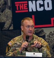 U.S. Army Col. Thomas B. Smith, the chief of staff of the 1st Infantry Division, speaks at a Year of the Noncommissioned Officer Panel, at Victory Chapel on Fort Riley, Kansas, August 15, 2023. Smith spoke to leaders across the Big Red One on topics such as becoming better NCOs for Soldiers and answered inquiries that the NCOs had. (U.S. Army photo by Pfc. Autumn Johnson)