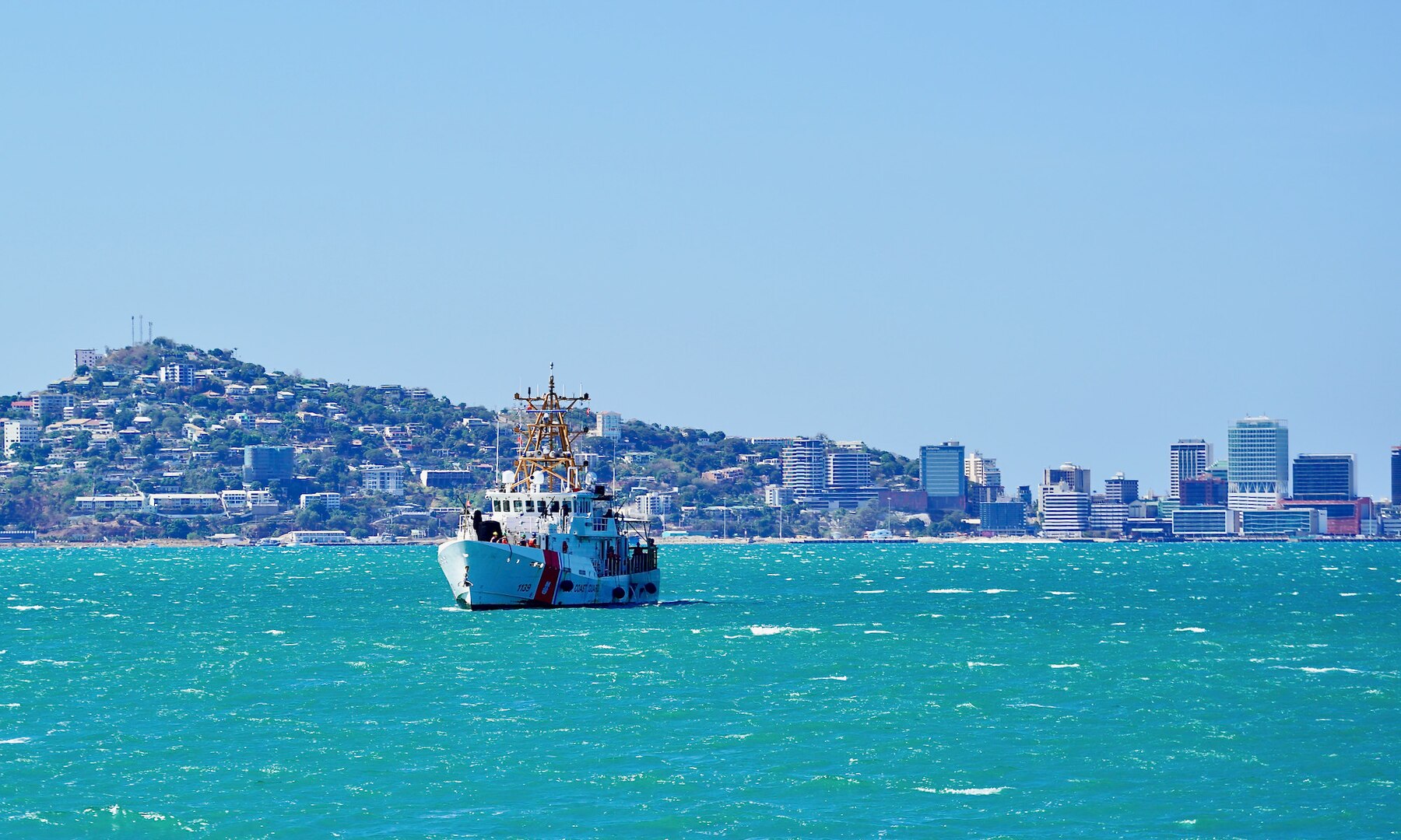 The crew of the USCGC Myrtle Hazard (WPC 1139) arrive to Port Moresby, Papua New Guinea, on Aug. 20, 2023. The U.S. Coast Guard is in Papua New Guinea at the invitation of the PNG government to join their lead in maritime operations to combat illegal fishing and safeguard maritime resources following the recent signing and ratification of the bilateral agreement between the United States and Papua New Guinea. (U.S. Coast Guard photo by Chief Warrant Officer Sara Muir)