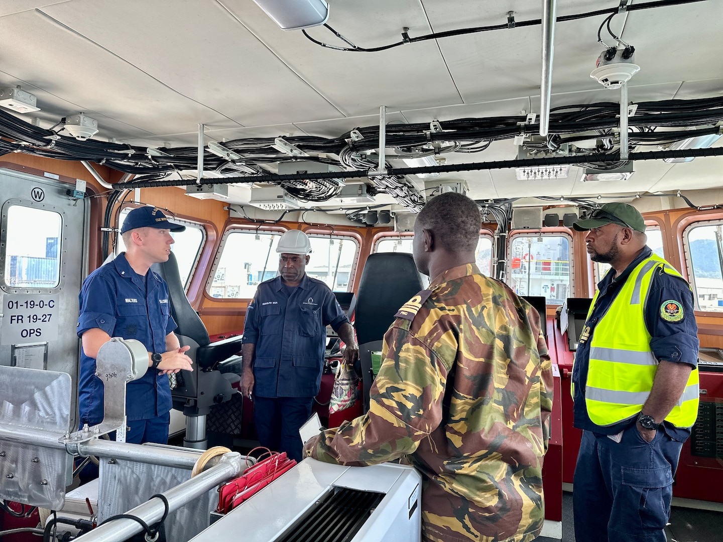 USCGC Myrtle Hazard (WPC 1139) hosts operational planning and subject matter exchange with partners in Port Moresby, Papua New Guinea on Aug. 22, 2023. The U.S. Coast Guard is in Papua New Guinea at the invitation of the PNG government to join their lead in maritime operations to combat illegal fishing and safeguard maritime resources following the recent signing and ratification of the bilateral agreement between the United States and Papua New Guinea. (U.S. Coast Guard photo by Chief Warrant Officer Sara Muir)