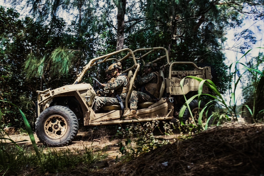 U.S. Marines with 3d Littoral Combat Team, 3d Marine Littoral Regiment, 3d Marine Division, drive a Utility Task Vehicle at Kahuku Training Area, Hawaii, June 9, 2023. 3d LCT conducted a nine-day field exercise to improve core competencies, discipline and continuing actions across the battalion. (U.S. Marine Corps photo by Cpl. Grace Gerlach)