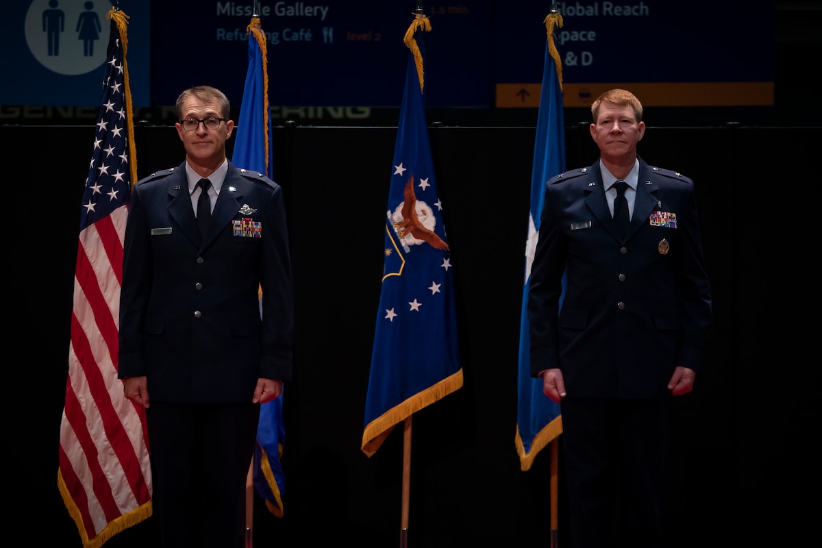Brig. Gen. Scott A. Cain, left, commander, Air Force Research Laboratory, or AFRL, and Brig. Gen. (Dr.) Robert K. Bogart, right, stand during an assumption of command ceremony at the National Museum of the U.S. Air Force, Aug. 21, 2023. Bogart became the seventh commander of AFRL’s 711th Human Performance Wing which has two mission units: the Human Effectiveness Directorate and the U.S. Air Force School of Aerospace Medicine. (U.S. Air Force photo / Richard Eldridge)