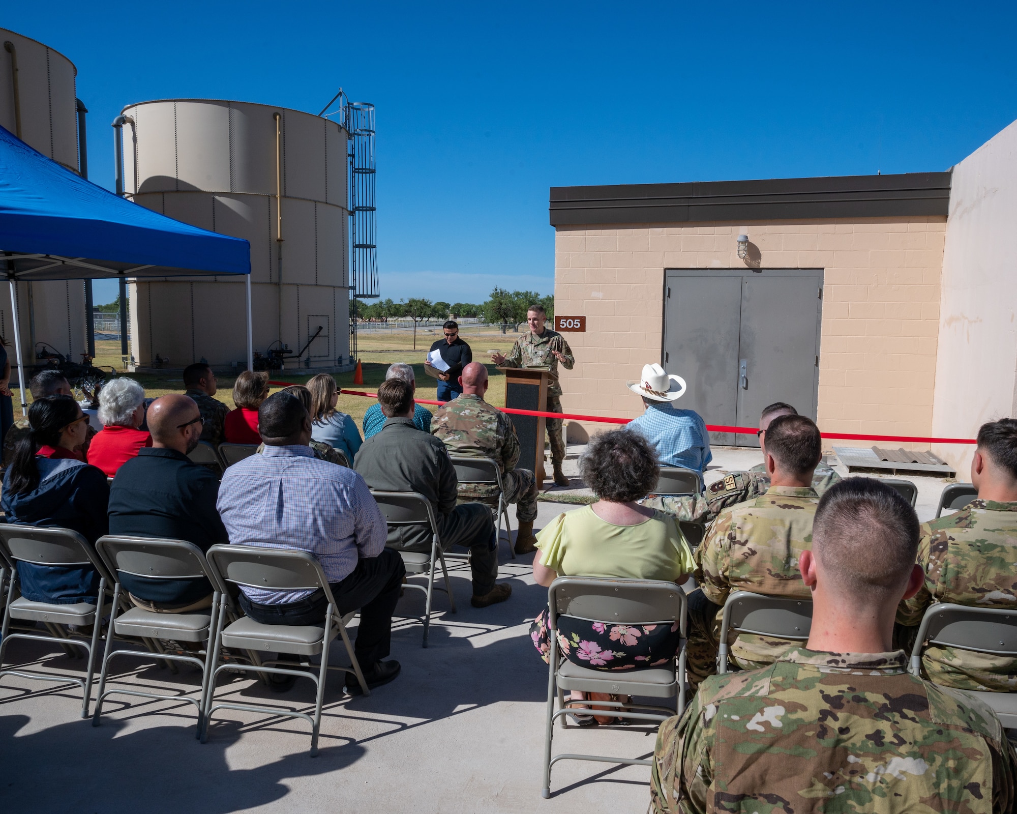U.S. Air Force Lt. Col. John Casey, 47th Civil Engineering Squadron commander, speaks about the importance of the improved airfield lighting project at Laughlin Air Force Base, Texas, Aug. 18, 2023. The new airfield lighting vault replaces Laughlin's 1960s era lighting system.  The vault, located next to the flightline, was refurbished to replace the lighting equipment with modern equivalents, helping ensure safer landings during nighttime training. (U.S. Air Force photo by Senior Airman Nicholas Larsen)