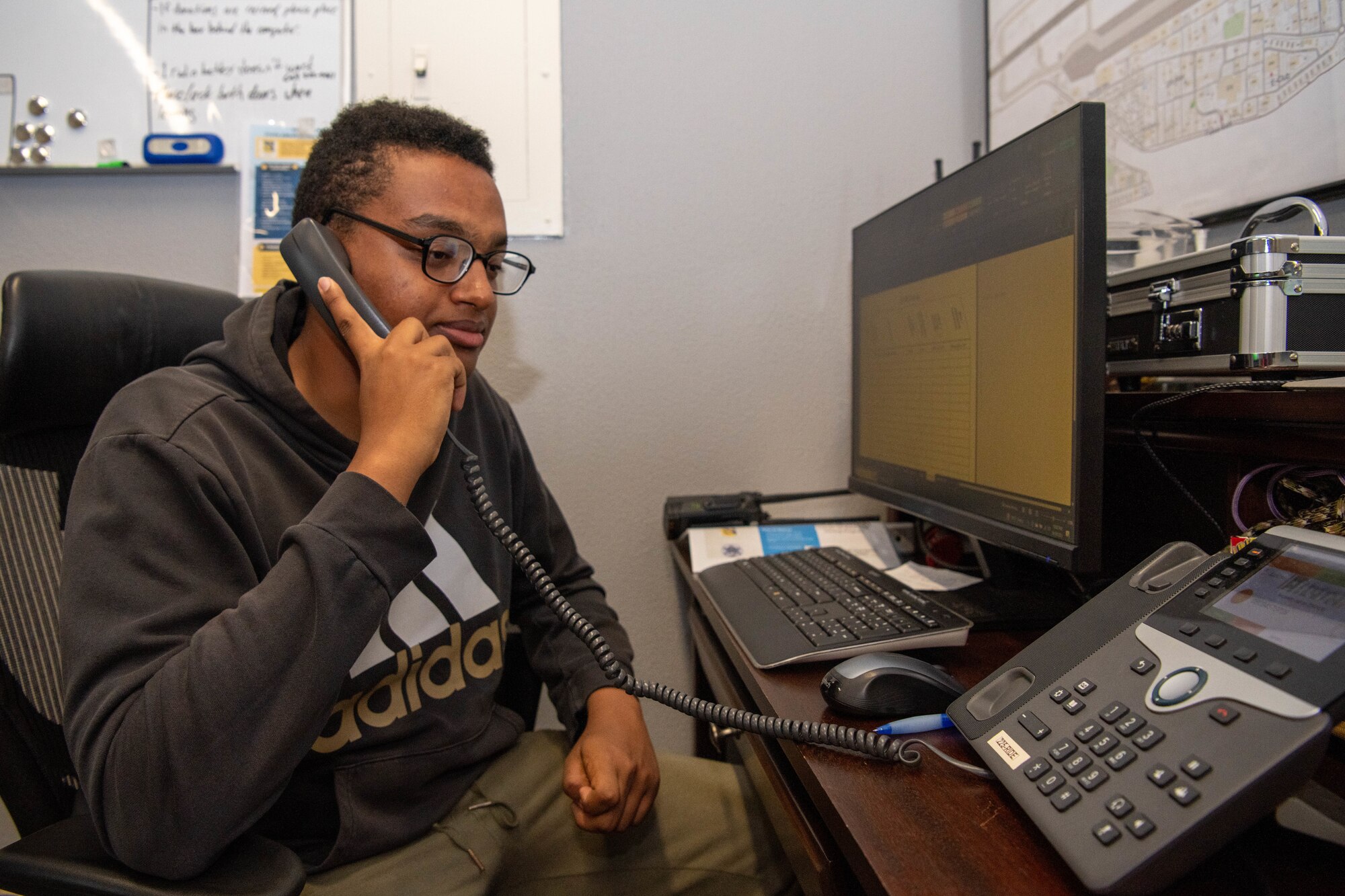 Airman picking up a call from someone in need of a ride.
