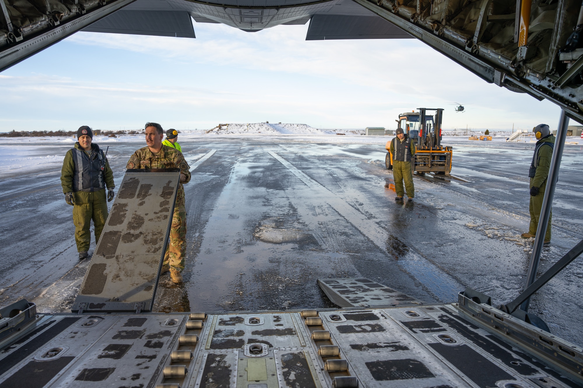 A C-130J Super Hercules loadmaster from the 39th Airlift Squadron out of the 317th Airlift Wing, Dyess AFB, TX prepares to offload a Chilean Army Humvee in Punta Arenas, Chile, July 28, 2023, during exercise Southern Star 23. Exercise Southern Star 23 is a Chilean-led full-scale Special Operations, Joint, and Combined Employment Exercise. The training consists of staff planning, tactical maneuvers, and collaboration among SOUTHCOM components’ staff, Chilean Armed Forces, and interagency partners during a stabilization scenario which facilitates the opportunity for participants to execute and assess the staff’s ability to plan, coordinate and execute command and control, logistical support, and decision-making processes in a crisis scenario. (U.S. Air Force photo by Staff Sgt. Clayton Wear)