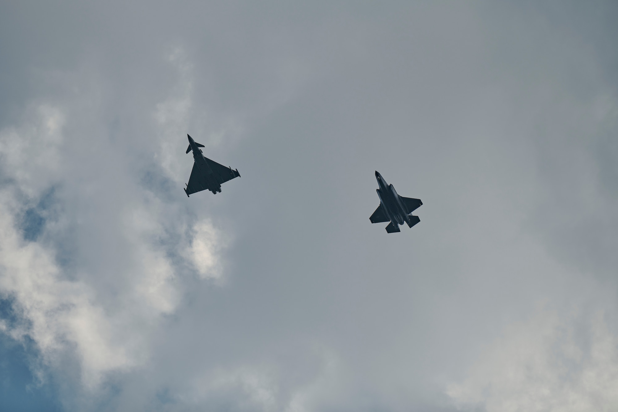 Photo of an F-35A Lightning IIs from the Vermont Air National Guard's 158th Fighter Wing and a Eurofighter Typhoons from the Austrian Air Force's Airspace Surveillance Wing, flying at Hinterstoisser Air Base from the first ever training sortie between Vermont and Austria since signing their State Partnership Program agreement, Zeltweg, Austria, June 17, 2023.