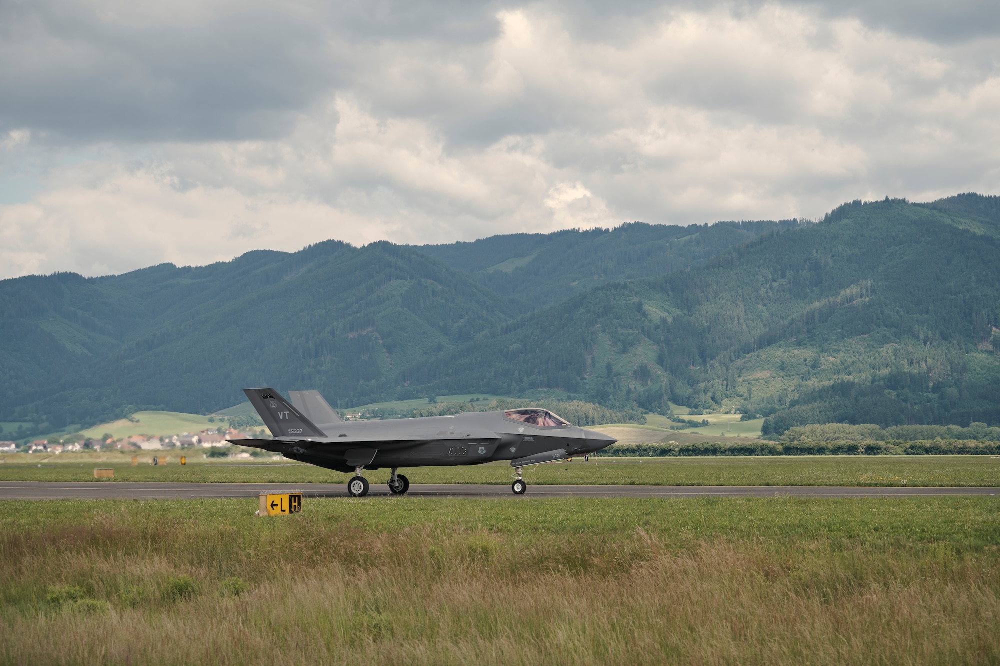 Photo of an F-35A Lightning IIs from the Vermont Air National Guard's 158th Fighter Wing taxing at Hinterstoisser Air Base for the first ever training sortie between Vermont and Austria since signing their State Partnership Program agreement, Zeltweg, Austria, June 17, 2023