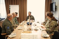 Photo of Austrian Maj. Gen. Hermann Kaponig, commander of the Austrian Communication and Information Systems and Cyber Defense Command, holds a meeting with Vermont National Guard leadership including State Command Chief Master Sgt. Jeffrey Stebbins and Air Component Commander of the Vermont National Guard, Brig. Gen. Henry Harder, to discuss cybers security and training opportunities, at the Austrian Defense Academy, Vienna, Austria, June 15, 2023.