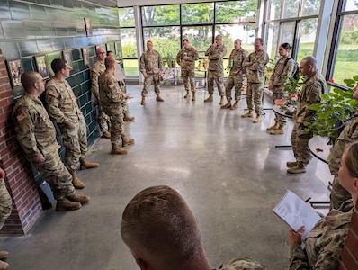 Photo of Vermont National Guard Soldiers and Airmen meeting for a Liaison Officer briefing to discuss assignments related to the historic flooding in the state of Vermont at Camp Johnson, Colchester, Vermont, July 19, 2023. The purpose of the Liaison Officer mission is to meet with town leaders and report information from the town back to the state for possible resourcing. (U.S. Air Force photo by Tech. Sgt. Richard Mekkri)