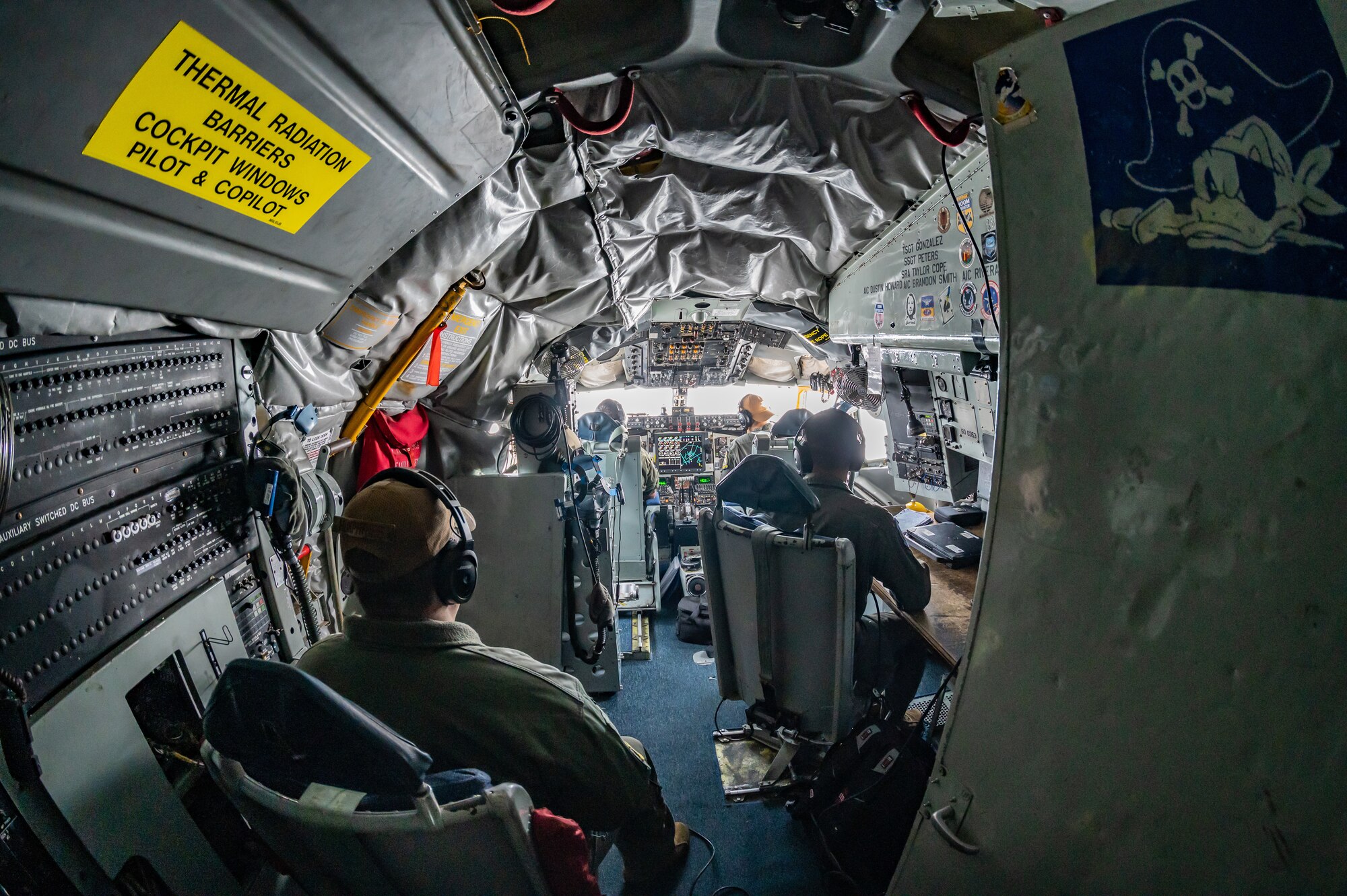 Aircrew assigned to the 351st Air Refueling Squadron, Royal Air Force Mildenhall, sit in the cockpit of a 100th Air Refueling Wing KC-135 Stratotanker aircraft August 18, 2023. Training with allies improves the readiness of U.S. forces to respond to aggression within Europe. (U.S. Air Force photo by Senior Airman Viviam Chiu)