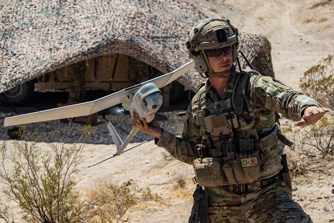 A soldier prepares to launch an unmanned aircraft.