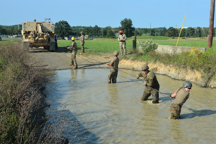 Soldiers attending the towing and recovery specialist course at the U.S. Army Reserve’s Regional Training Site – Maintenance at Fort Indiantown Gap conduct vehicle recovery training at FTIG’s mire pit on Aug. 22, 2023. The class included active-duty, Army Reserve and National Guard Soldiers. (Pennsylvania National Guard photo by Brad Rhen)