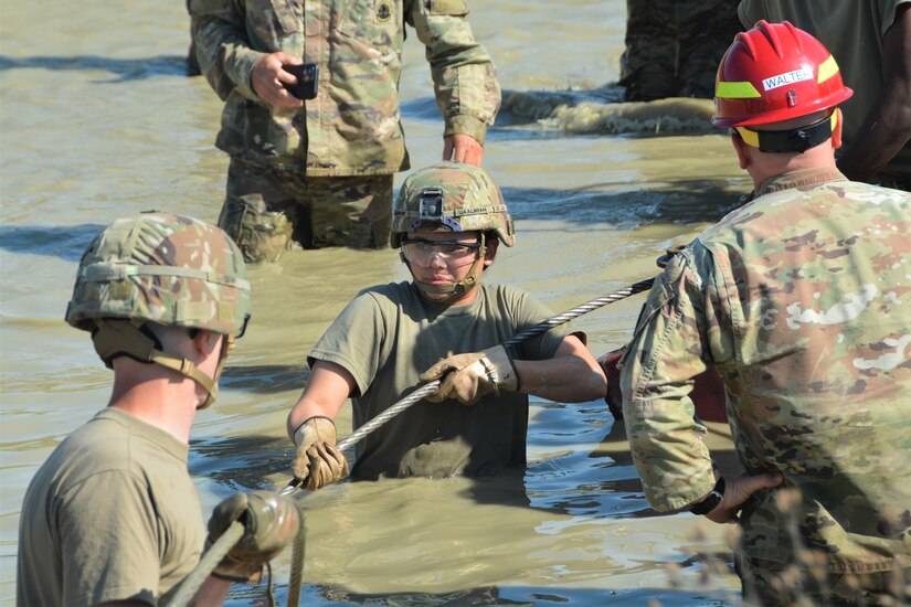 Soldiers attending the towing and recovery specialist course at the U.S. Army Reserve’s Regional Training Site – Maintenance at Fort Indiantown Gap conduct vehicle recovery training at FTIG’s mire pit on Aug. 22, 2023. The class included active-duty, Army Reserve and National Guard Soldiers. (Pennsylvania National Guard photo by Brad Rhen)