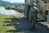 Soldiers attending the towing and recovery specialist course at the U.S. Army Reserve’s Regional Training Site – Maintenance at Fort Indiantown Gap conduct vehicle recovery training at FTIG’s mire pit on Aug. 22, 2023. The class included active-duty, Army Reserve and National Guard Soldiers. (Pennsylvania National Guard photo by Brad Rhen)