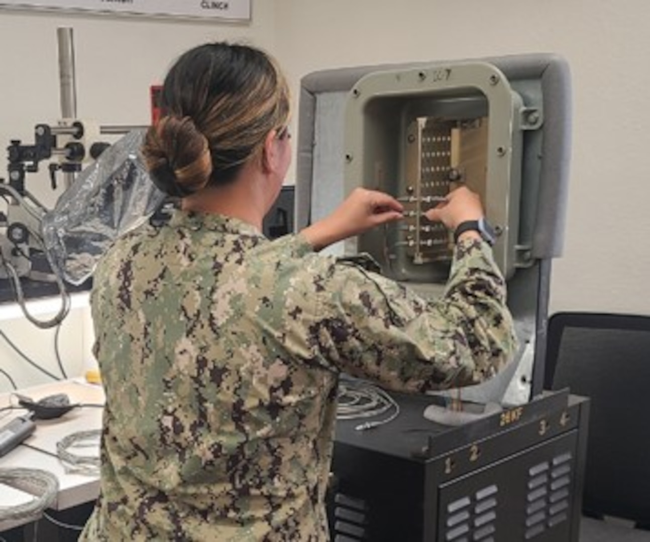IMAGE:  A Navy electronics technician undergoes Fiber Optics Test and Repair recertification at Naval Station San Diego in 2022.