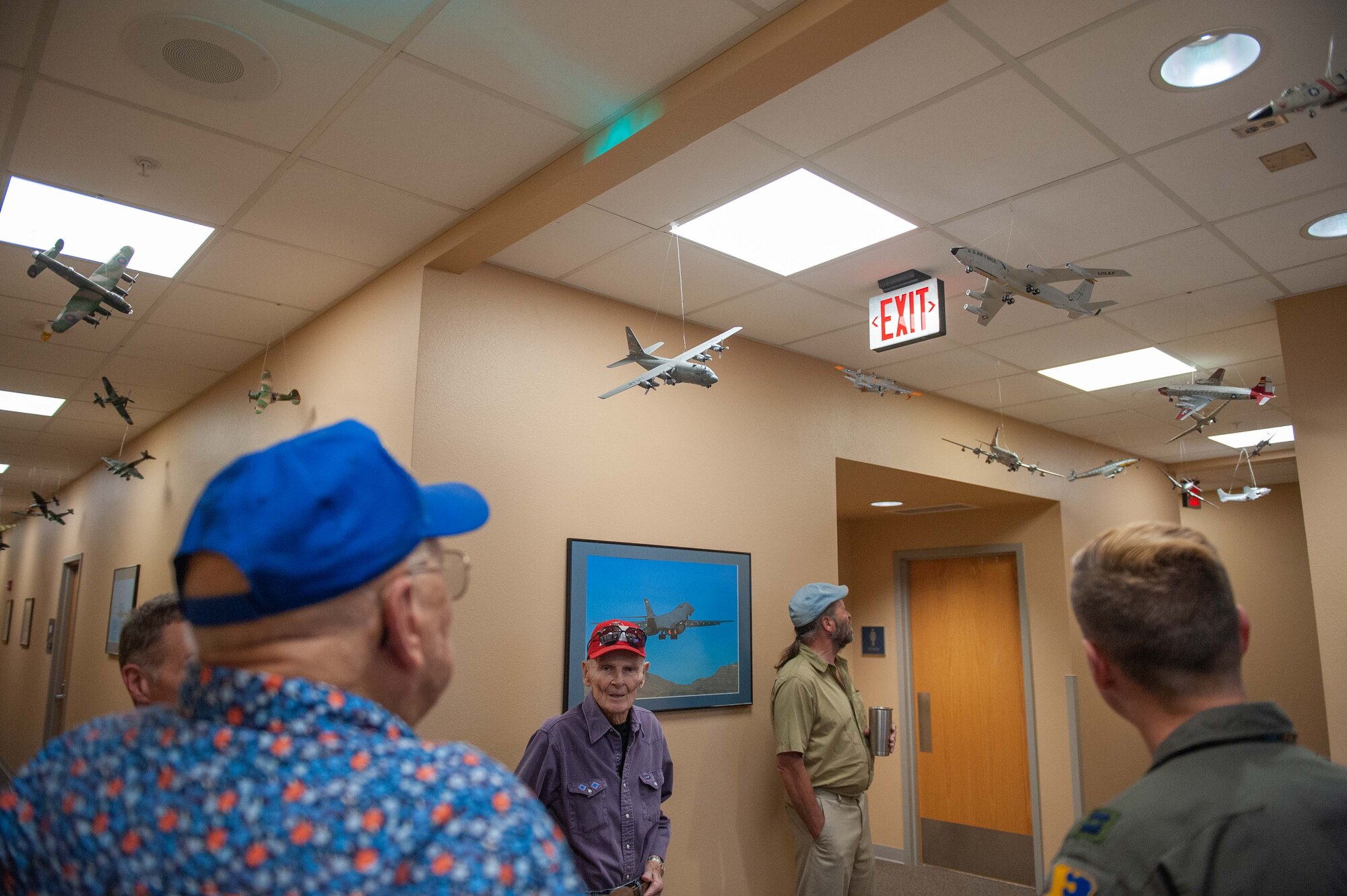 Mr. Don Peck (Left), a former U.S. Air Force firefighter receives a tour of the Joe D. Brown IV Mission Training Center in which he donated many model airplanes at Ellsworth Air Force Base, South Dakota, Aug. 17, 2023. The facility personnel have decorated the building with the models, organizing them by branch of service, era of use and country of origin. Aircraft in this corner of the facility were all flown in the same time period and could feasibly have flown together in real life. (U.S. Air Force photo by Spc3 Adam Olson)