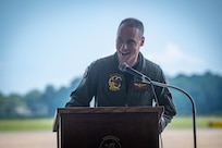 Pilot speaks at podium