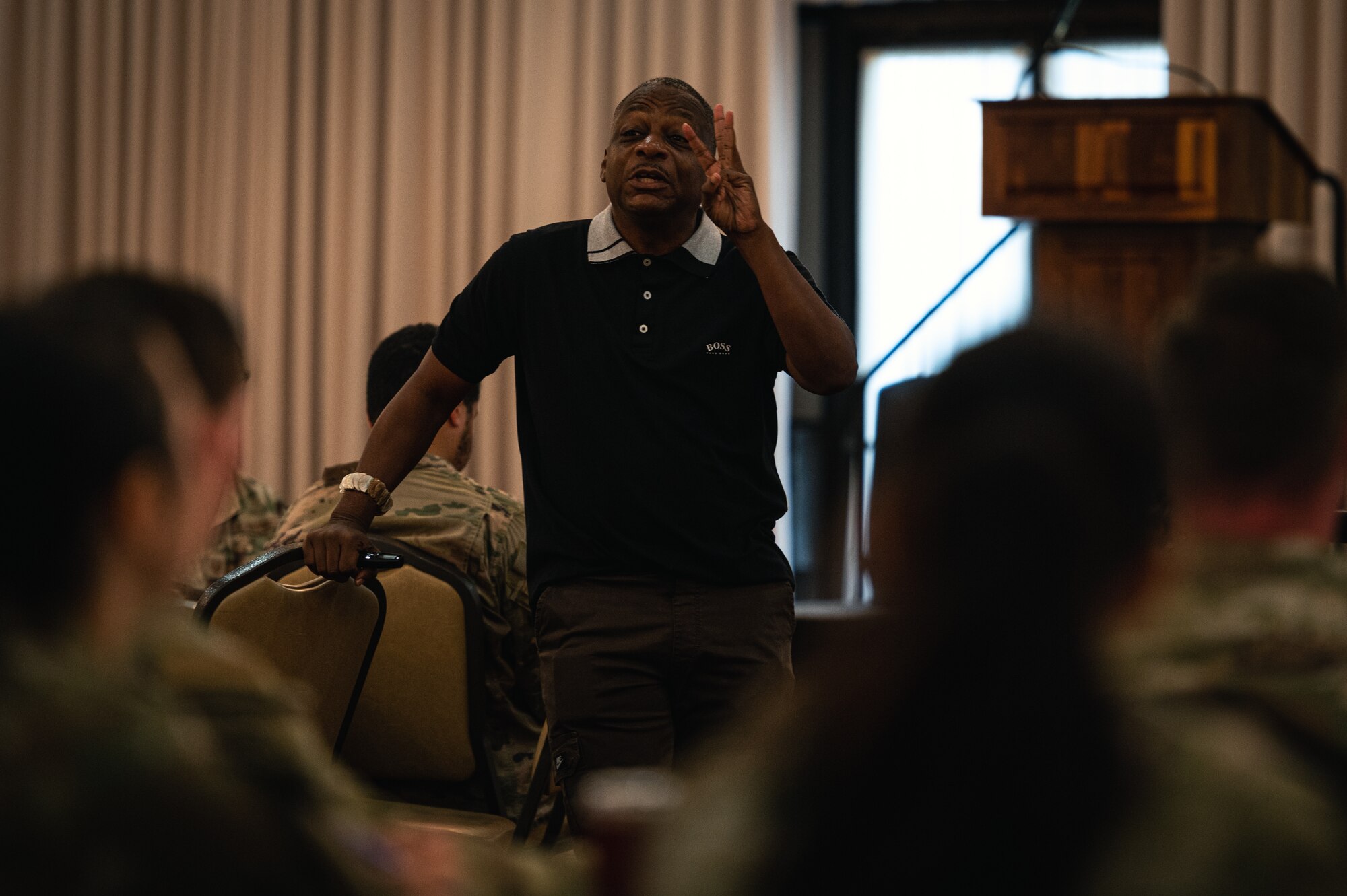 Anthony Brinkley, On the Brink Affirmation Services chief executive officer, discusses the importance of mental fortitude during a Warrior Heart keynote speech at Joint Base McGuire-Dix-Lakehurst, N.J., Aug. 22, 2023. The two-day keynote event launched the AMC-wide effort and introduced the concept of mindfulness to Airmen, spouses, and civilians. (U.S. Air Force photo by Senior Airman Sergio Avalos)