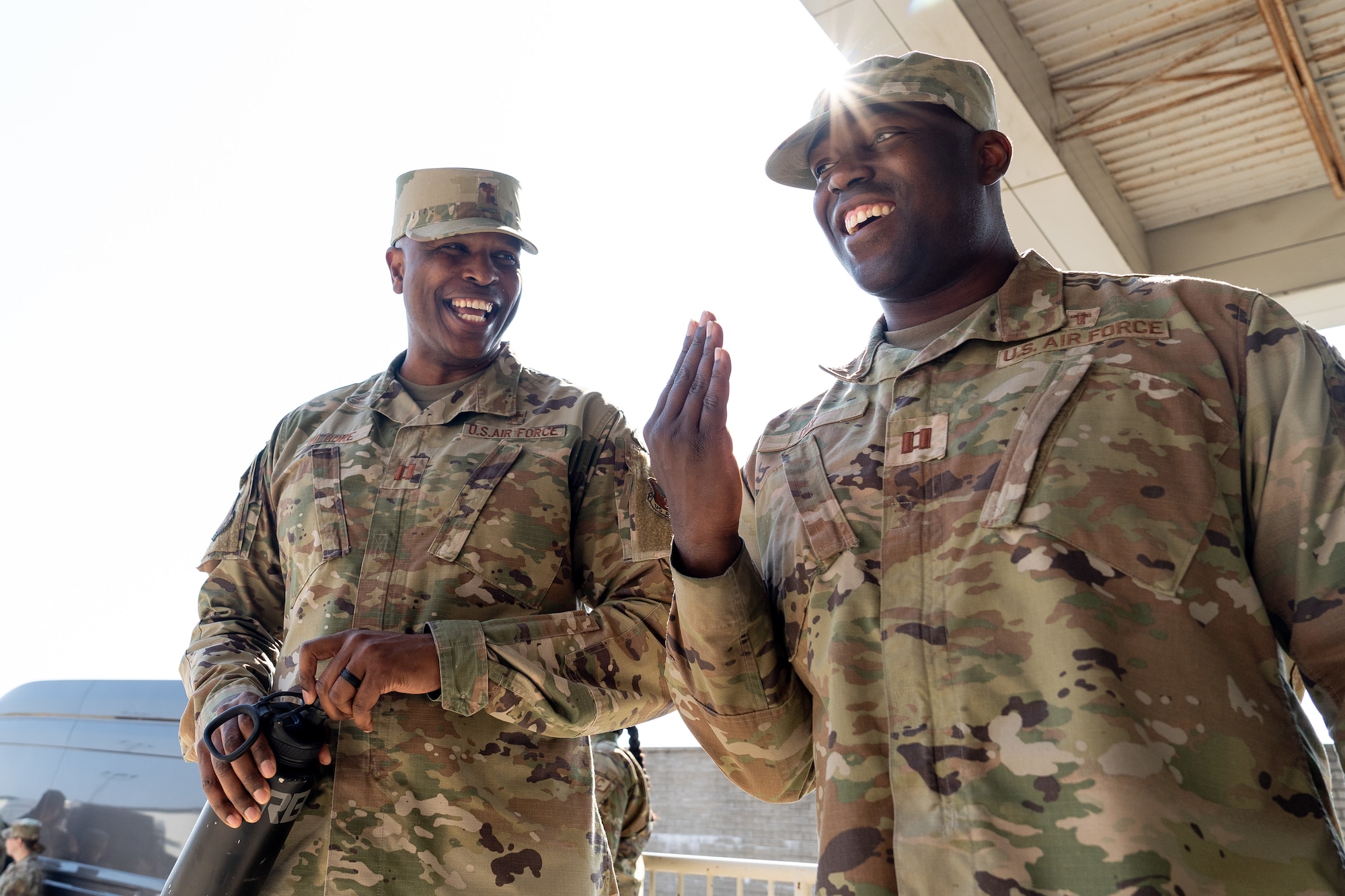 Two chaplains smiling at each other