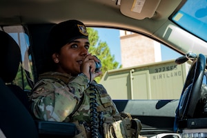 A woman speaks into a radio.